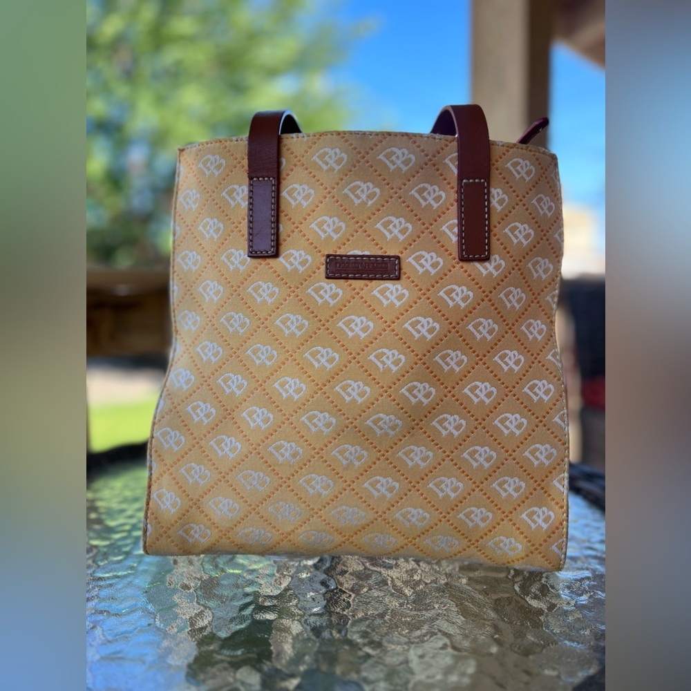 Dooney & Bourke North South signature print yellow canvas shoulder bag